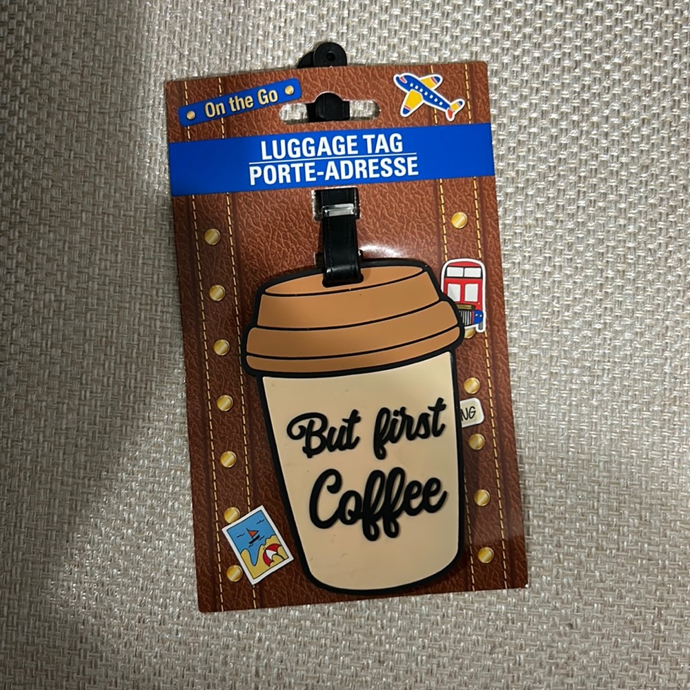 Luggage tag. It says COFFEE FIRST